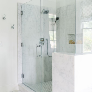 womack custom homes enclosed shower with marble details